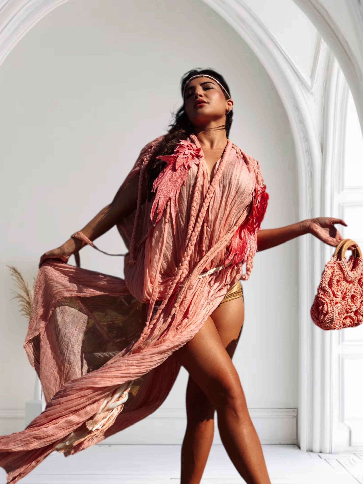 Model in a dusty rose bohemian dress