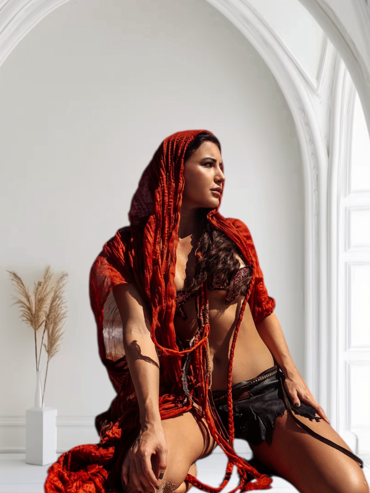 Model in a rust-toned handmade piece